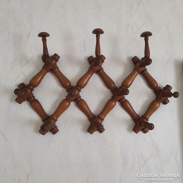 Wall-mounted wooden coat hanger, openable, antique, at least 100 years old. Adjustable size