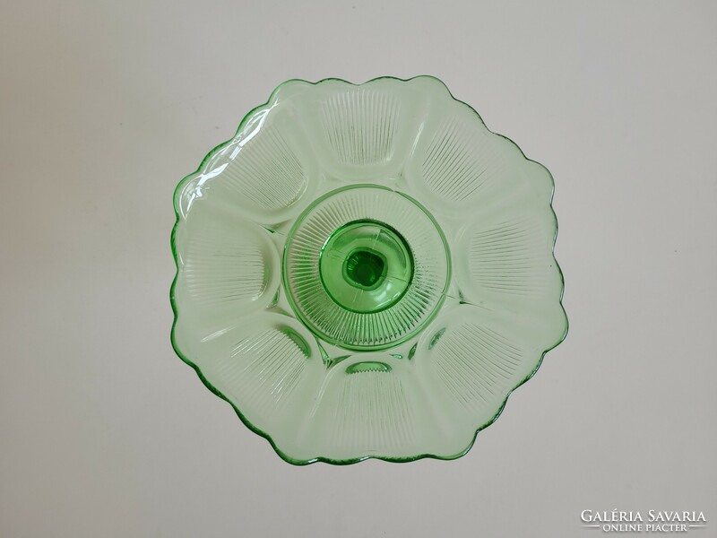 Vintage bowl serving fruit in old stemmed green glass bowl