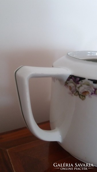Old porcelain tea pot with rose pattern vintage spout