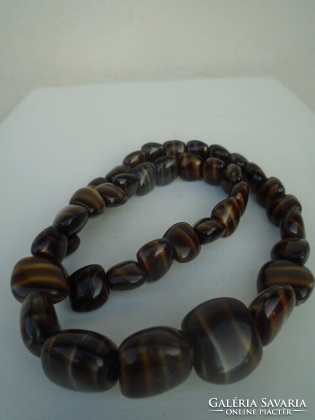 A tiger eye chain in one of the rarest colors available is a serious weight