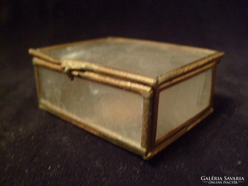 A filigree jewelry holder with mother-of-pearl luster with a copper border, a rarity