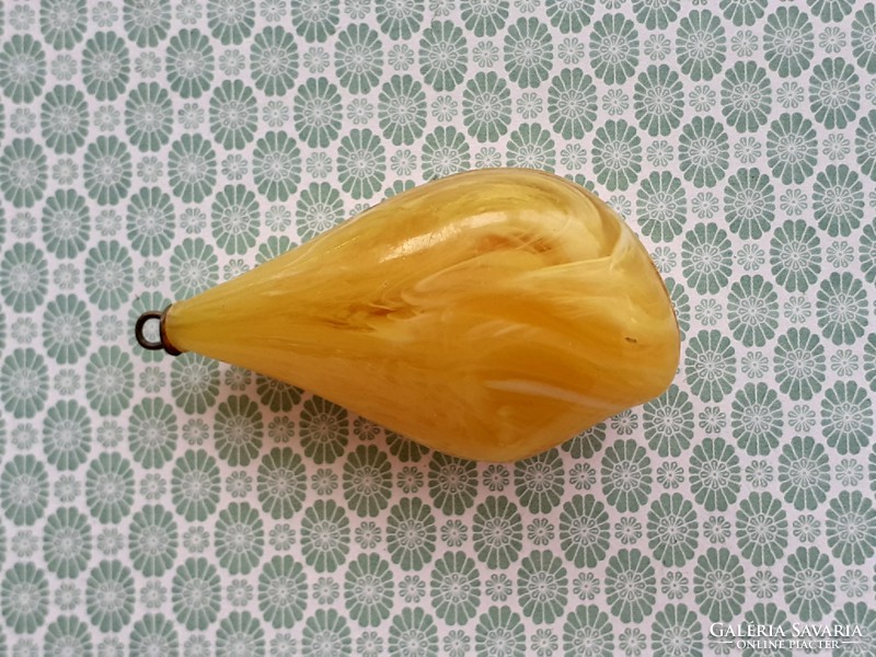 Old female plastic pendant in the shape of a drop