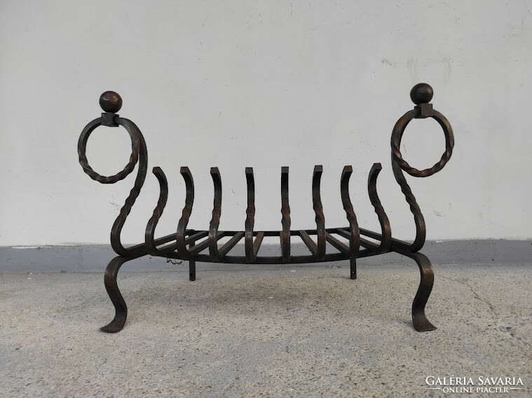 Antique wrought iron stove ember holder in front of the fireplace 378 5734