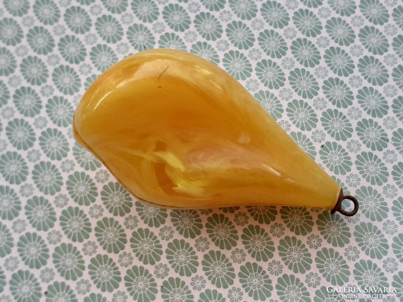 Old female plastic pendant in the shape of a drop