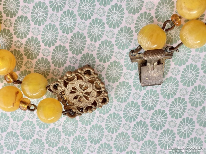 Old women's necklace with yellow plastic retro double row of pearls