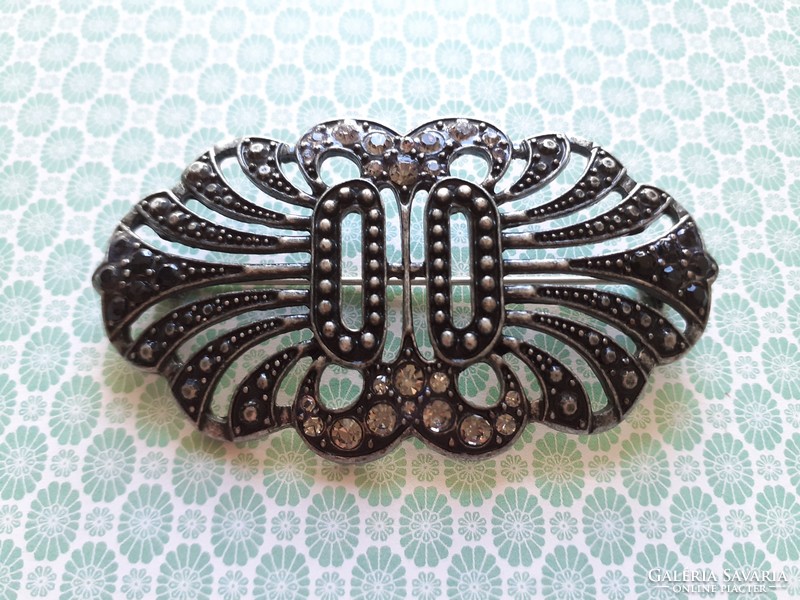 Old women's brooch with vintage metal badge