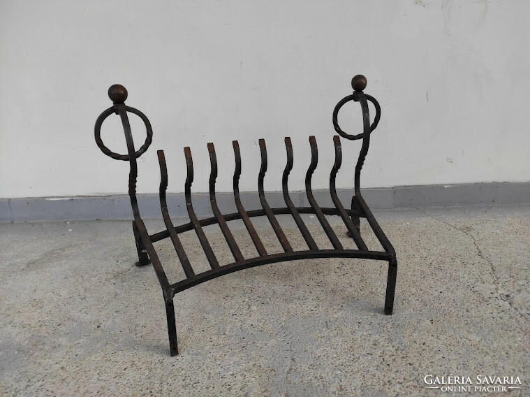 Antique wrought iron stove ember holder in front of the fireplace 378 5734