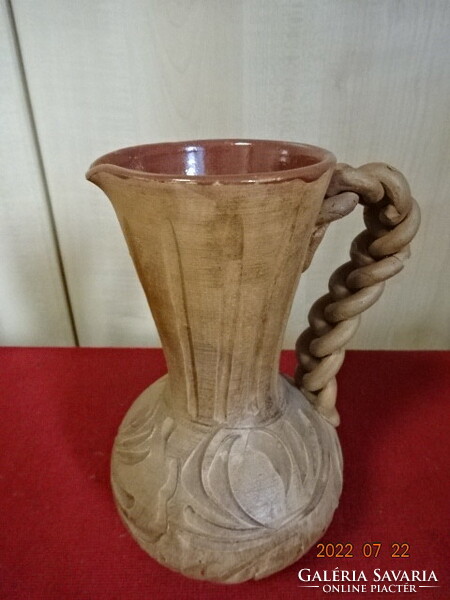 Patterned ceramic jug with inner glaze and braided handle. He has! Jokai.