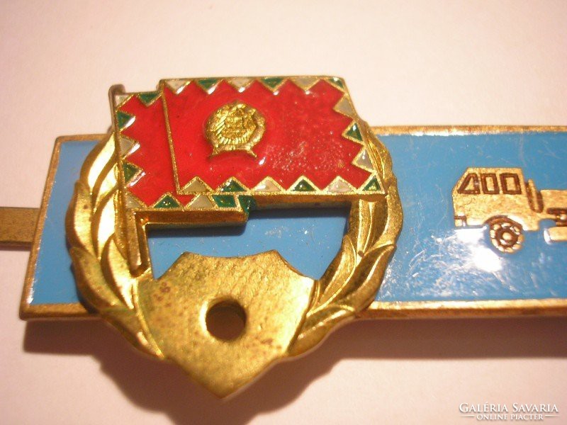 E12 military rating fire enamel badge for tgk driving classification in good condition