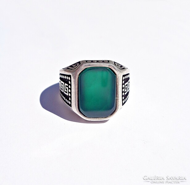 Sterling silver ring with green stones