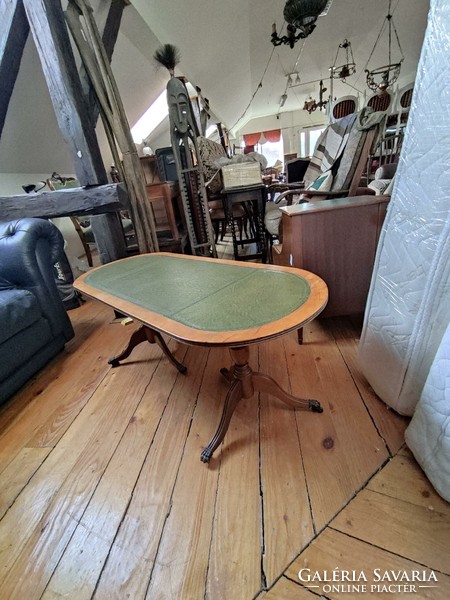 Oval coffee table with clawed legs
