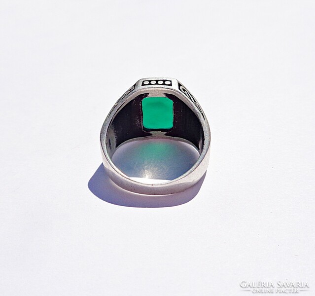 Sterling silver ring with green stones