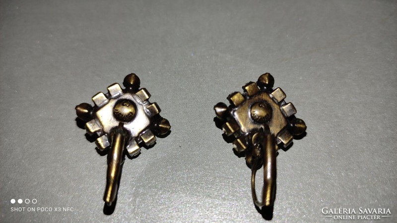 A pair of unique vintage jewelry earrings with marked plot by Miranda Konstantinidou design