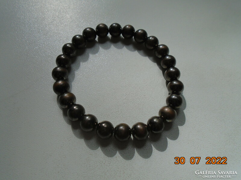 Bracelet made of gold and brownish steel gray beads