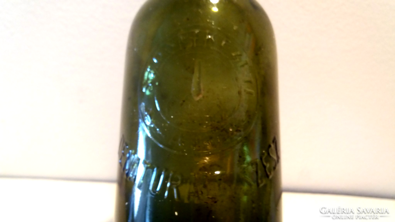 Old bottle denatured spirit labeled green glass