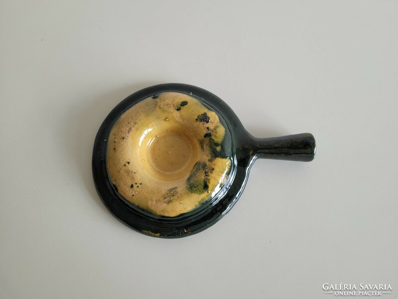 Old vintage glazed folk ceramic egg holder with handle offering Easter eggs