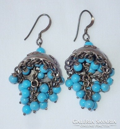 Vintage sterling silver pair of logo earrings decorated with turquoise stones