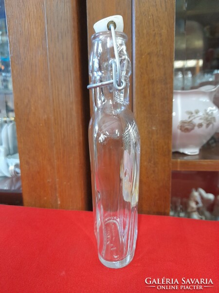 Flat glass bottle with Italy deer pattern buckle.
