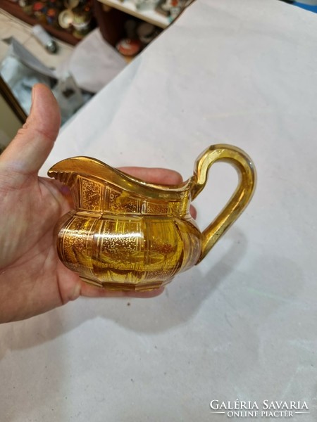 Old gilded glass spout