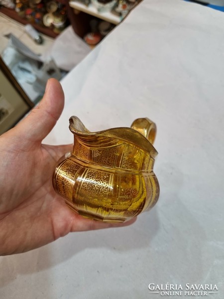 Old gilded glass spout