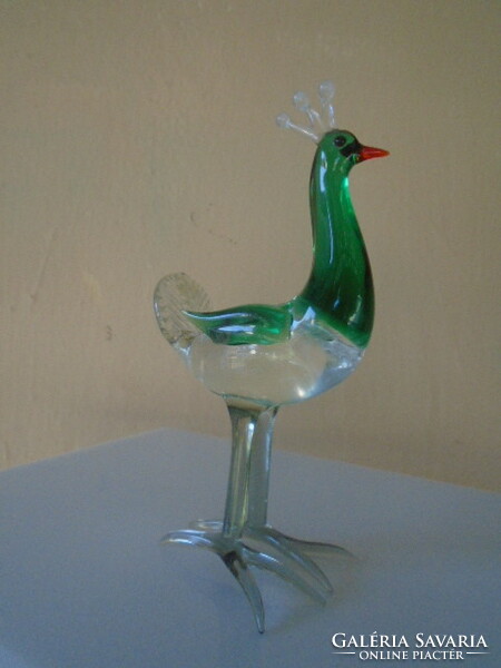 Murano's glass king peacock figure is not visible, but it has a bluish color