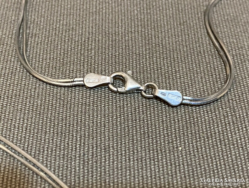 Silver necklace with stone pendants.