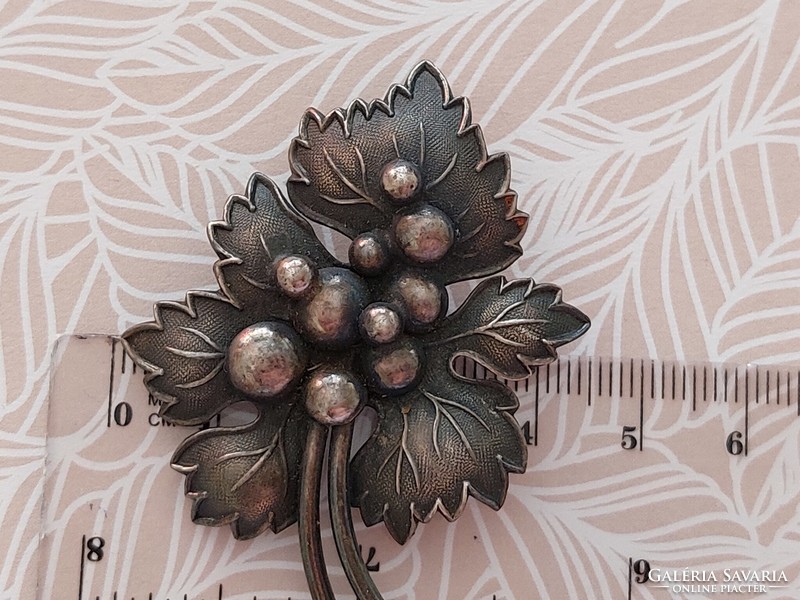 Old brooch metal leaf-shaped vintage badge
