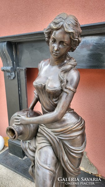 Antique art nouveau bronze sculpture: woman with a jug