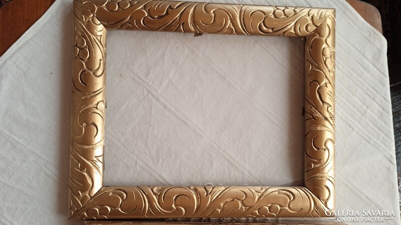 Antique gold painted deeply carved picture frame