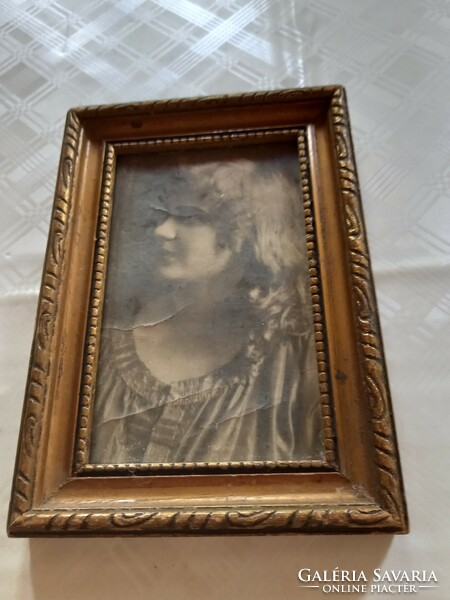 Rego photo glass in a wooden frame