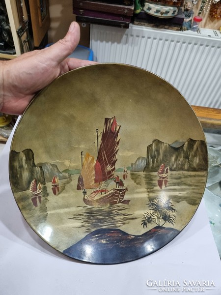 Old oriental lacquered wooden plate