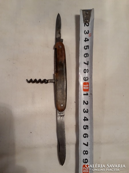 Old multifunctional pocket knife, pocketknife, angled handle