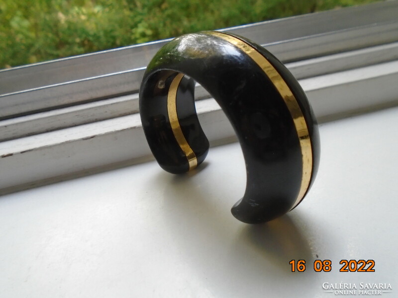 Elegant black lacquered wide, thick wooden bracelet with a gilded copper strip
