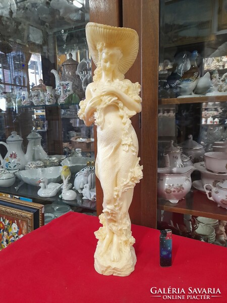 Large alabaster figure statue of a lady with a dovecote hat. 50 Cm.