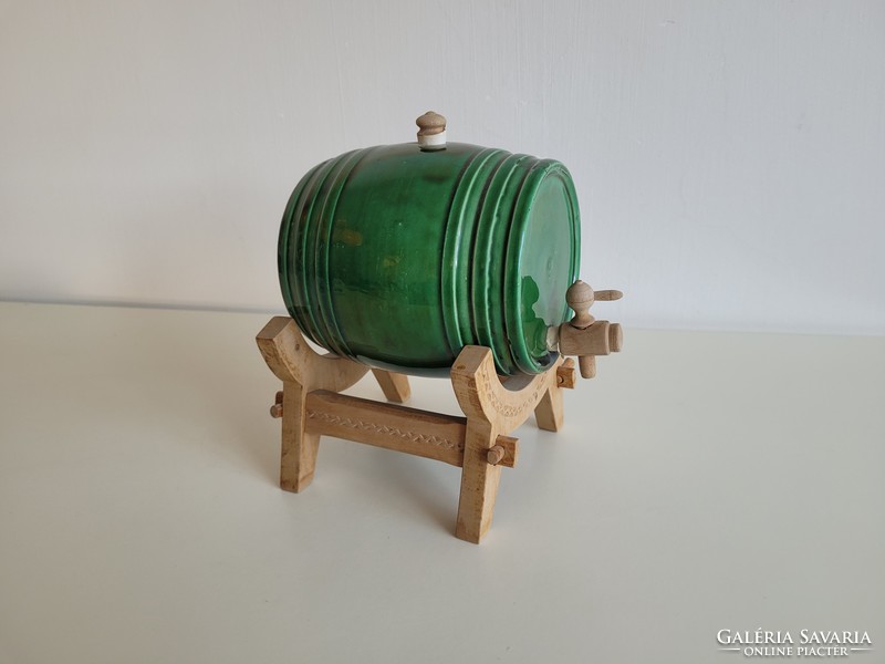 Old retro ceramic brandy wine barrel on a stand