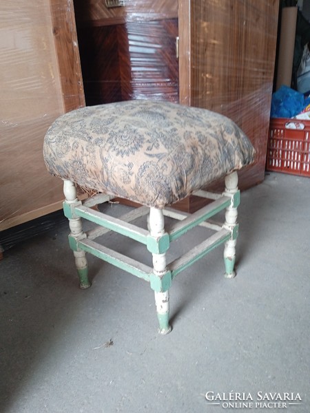 Old, cheerfully colored seat, 50 cm high, for home decoration.