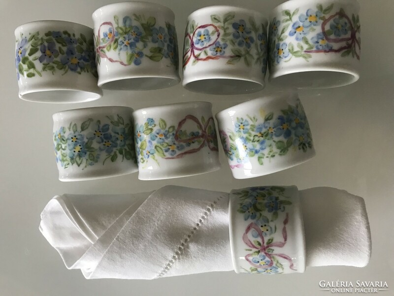 Porcelain napkin rings, each piece hand painted and signed