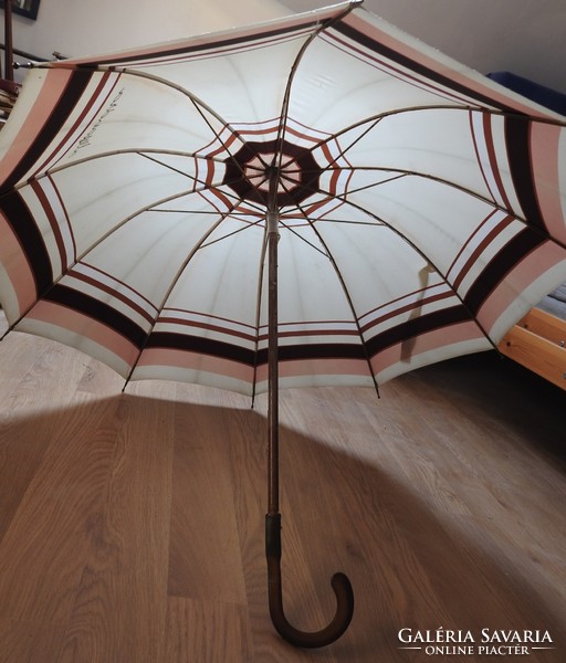 Old alexandra pastel colored wooden umbrella with vinyl handle