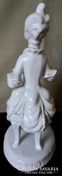Dt/085 - woman from Hóllóháza, in baroque dress, reading sheet music, porcelain figurine with underglaze