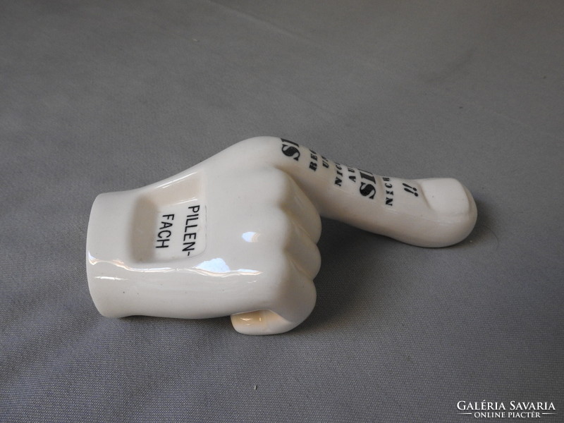 Medicine pill holder in the shape of a hand