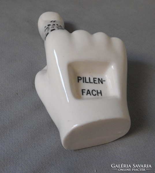 Medicine pill holder in the shape of a hand