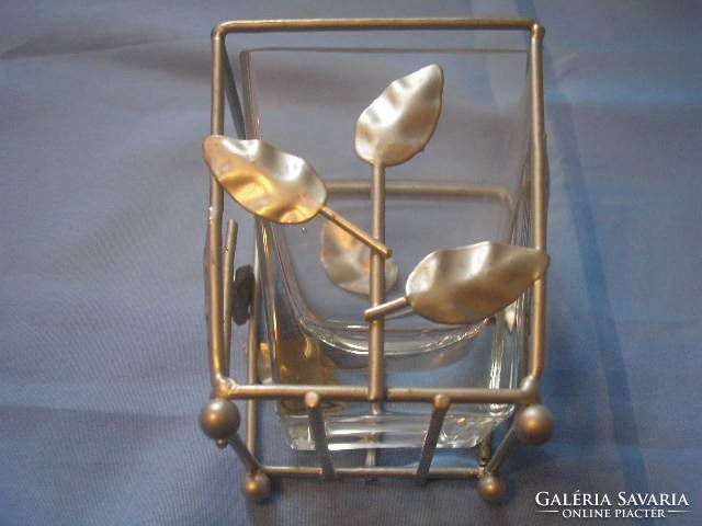 A decorative, antique Swedish glass holder for mugs covered with metal decorations. For a pen holder