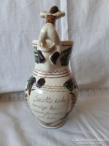 A rare Korund bait jug with a female figure