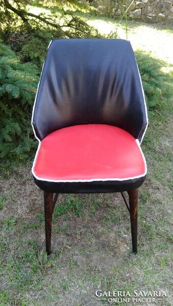 Retro renovated shell chair with red and black sky cover, wooden frame, stable condition, 1950s-60s