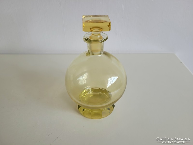 Old liqueur glass yellow short drink spherical corked bottle