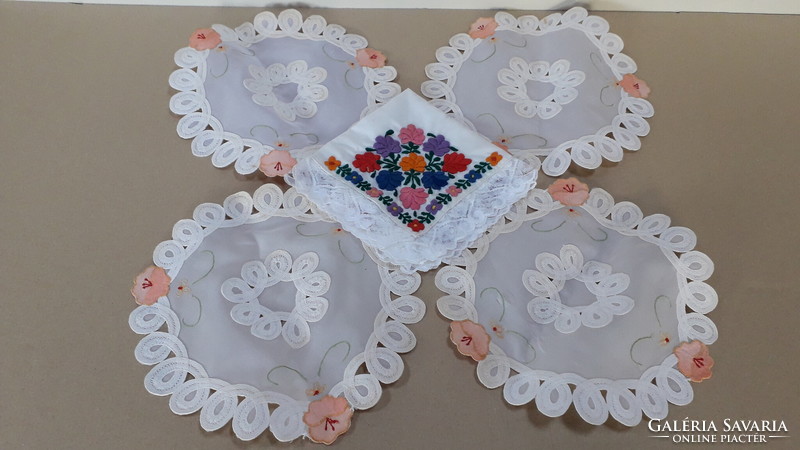 4 small round tablecloths and an embroidered handkerchief