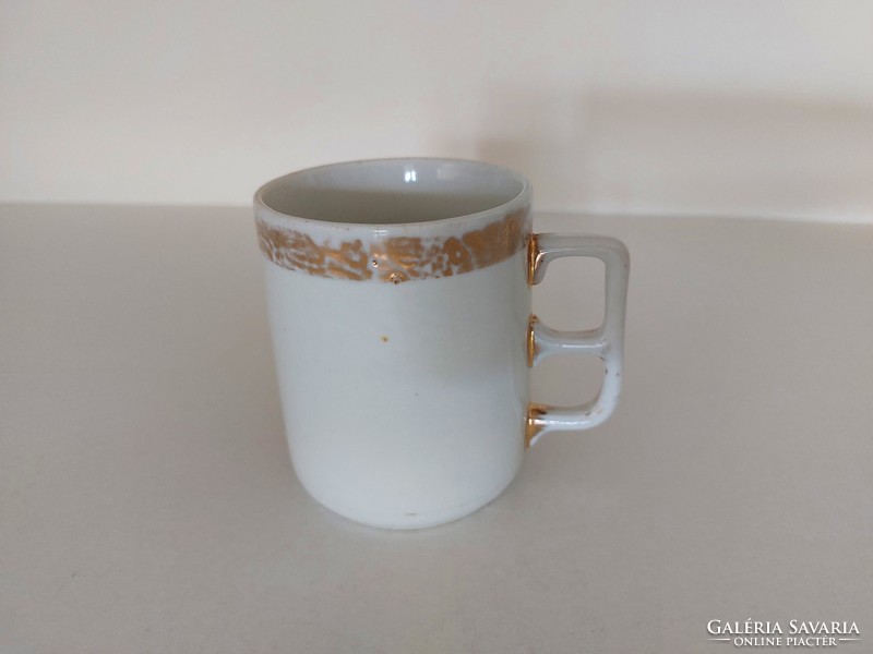 Old gilded vintage white porcelain mug art nouveau tea cup