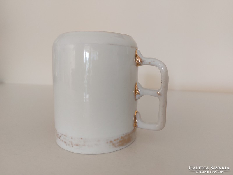 Old gilded vintage white porcelain mug art nouveau tea cup