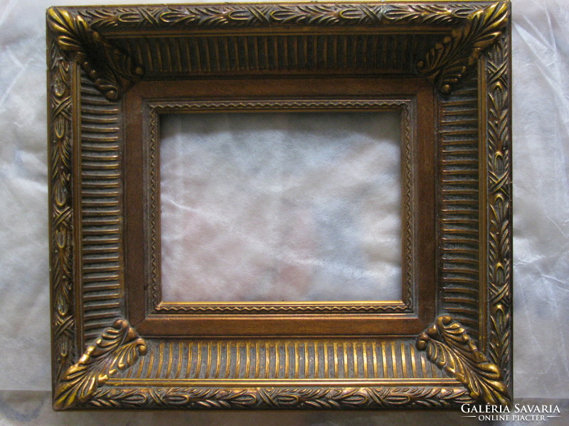 Wide, gilded old picture frame