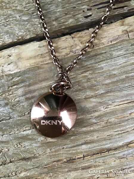 Original dkny rosé gold necklace with pendant decorated with gilded zirconia stones